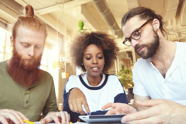 A close-up shot of a diverse group of people collaborating around a table, reviewing a style guide on a tablet and discussing edits. The atmosphere is collaborative and focused, emphasizing teamwork and attention to detail.