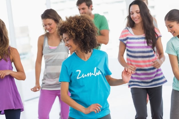 A group of people laughing and having fun during a Zumba class, capturing the enjoyable and social aspect of group exercise.