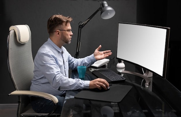 A person sitting at a desk with an ergonomically optimized setup, showing proper monitor placement, posture, and lighting.