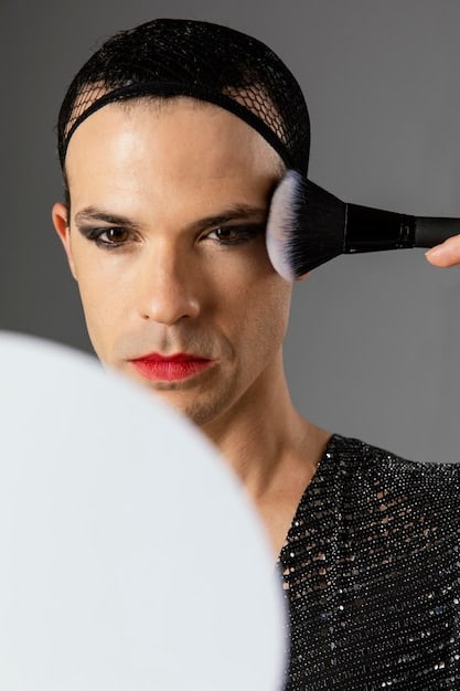 A close-up shot of a makeup artist blending contour on a model's face using a blending brush. The image focuses on the technique and the seamless transition between the contour and the skin.