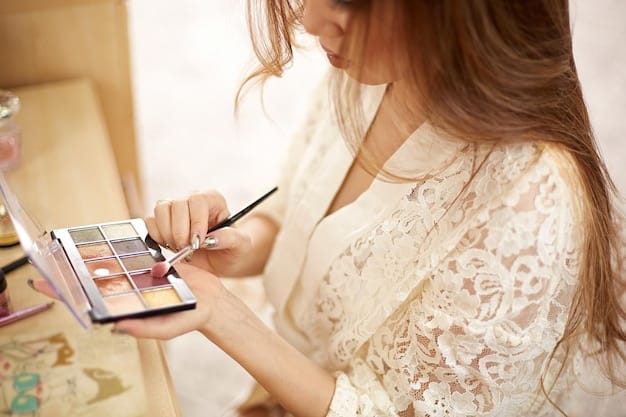 A makeup artist carefully applying eyeshadow on a bride, using soft, neutral tones to create a subtle and elegant eye look.