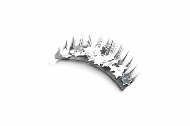 A variety of false eyelashes displayed on a white background, showcasing different styles (natural, dramatic, wispy) and materials (synthetic, mink, faux mink).