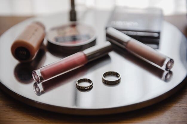 Close-up of a bride's makeup vanity showcasing a collection of high-end, long-lasting makeup products, including foundation, concealer, eyeshadow palette, lipstick, and setting spray. Each product is carefully selected for its quality and longevity.