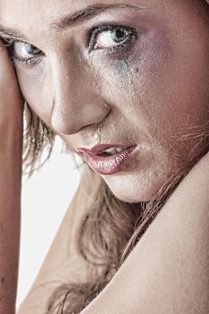 Close-up of a person's face showing enlarged pores and slight oiliness. The focus is on the skin's texture, highlighting the effects of humidity on pore size and oil production.
