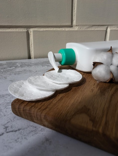 Close-up of various nighttime skincare products arranged neatly on a bathroom counter. Items include cleanser, serum, moisturizer, and eye cream, each labeled with its function.