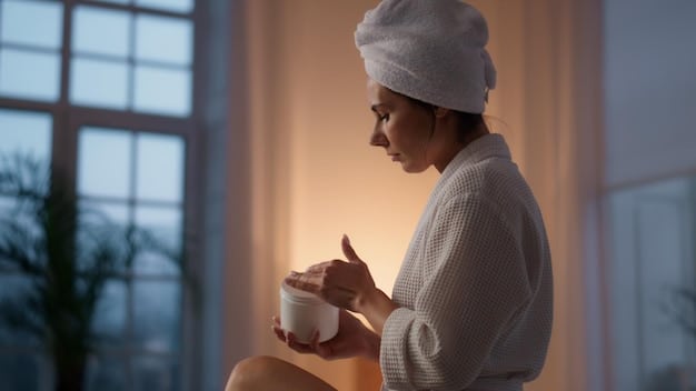 A woman gently applying night cream to her face in a dimly lit bathroom, with a serene expression. Focus is on the application technique and the texture of the cream.