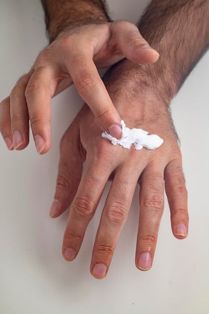 Close-up of a hand applying a thick, emollient cream to a patch of very dry, cracked skin on an arm, illustrating intense moisturization and repair.