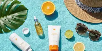 Essential summer skincare products for 2026, including sunscreen and serum, ready for a sunny day.